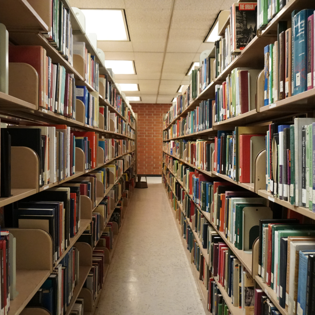 An isle of a library showing many books
